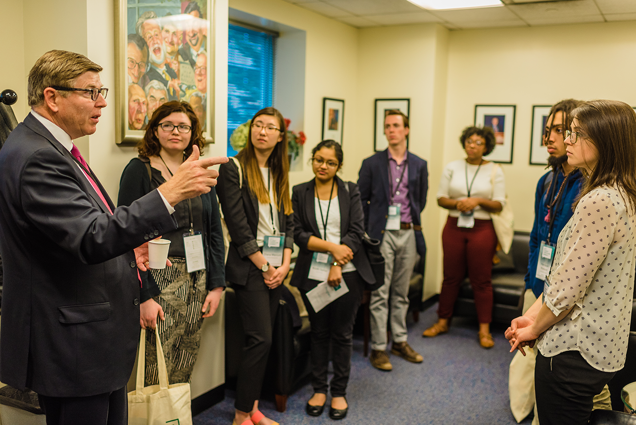 The Planet Forward Correspondents meet with Land O&#039;Lakes CEO Chris Policinski (left) during the networking break.
